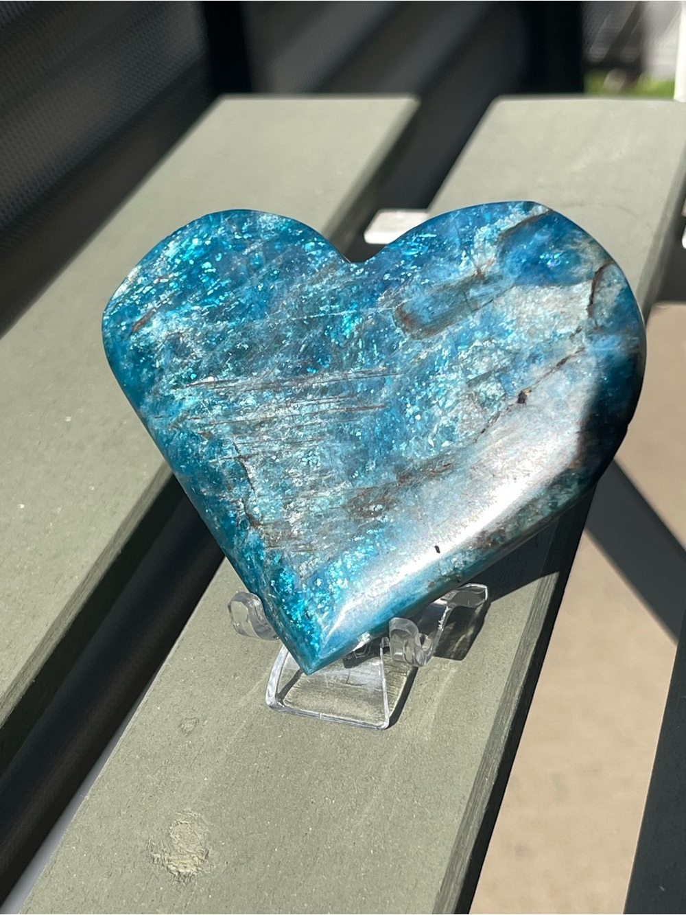 Blue Apatite Crystal Heart Carving with Blue Flash on Clear Stand